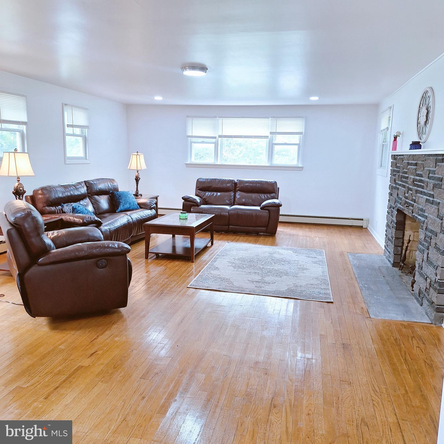 734 Pulaski Highway Bear, DE 19701 - Photo 5 of 20 a living room with furniture and a fireplace