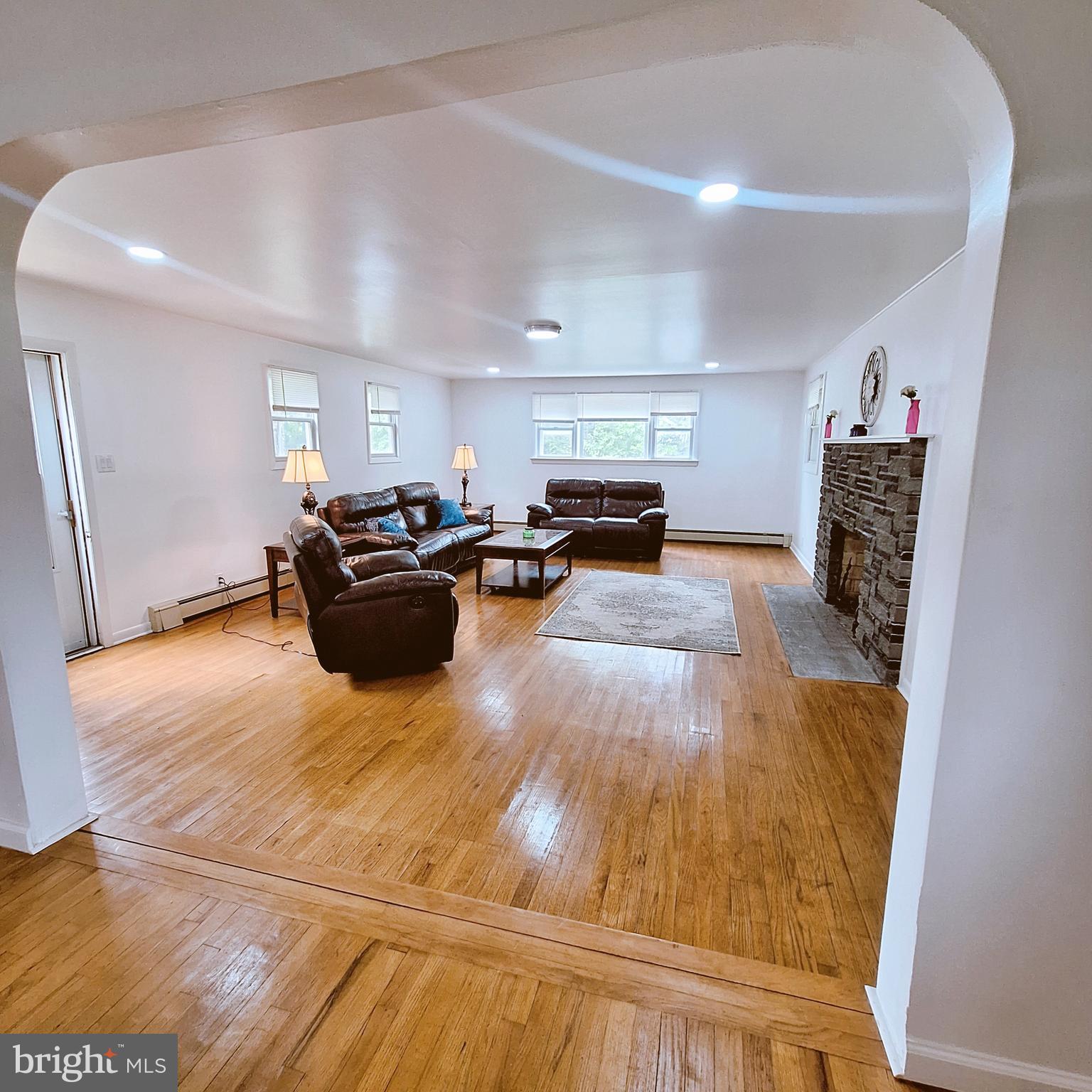 734 Pulaski Highway Bear, DE 19701 - Photo 7 of 20 a living room with furniture and a wooden floor