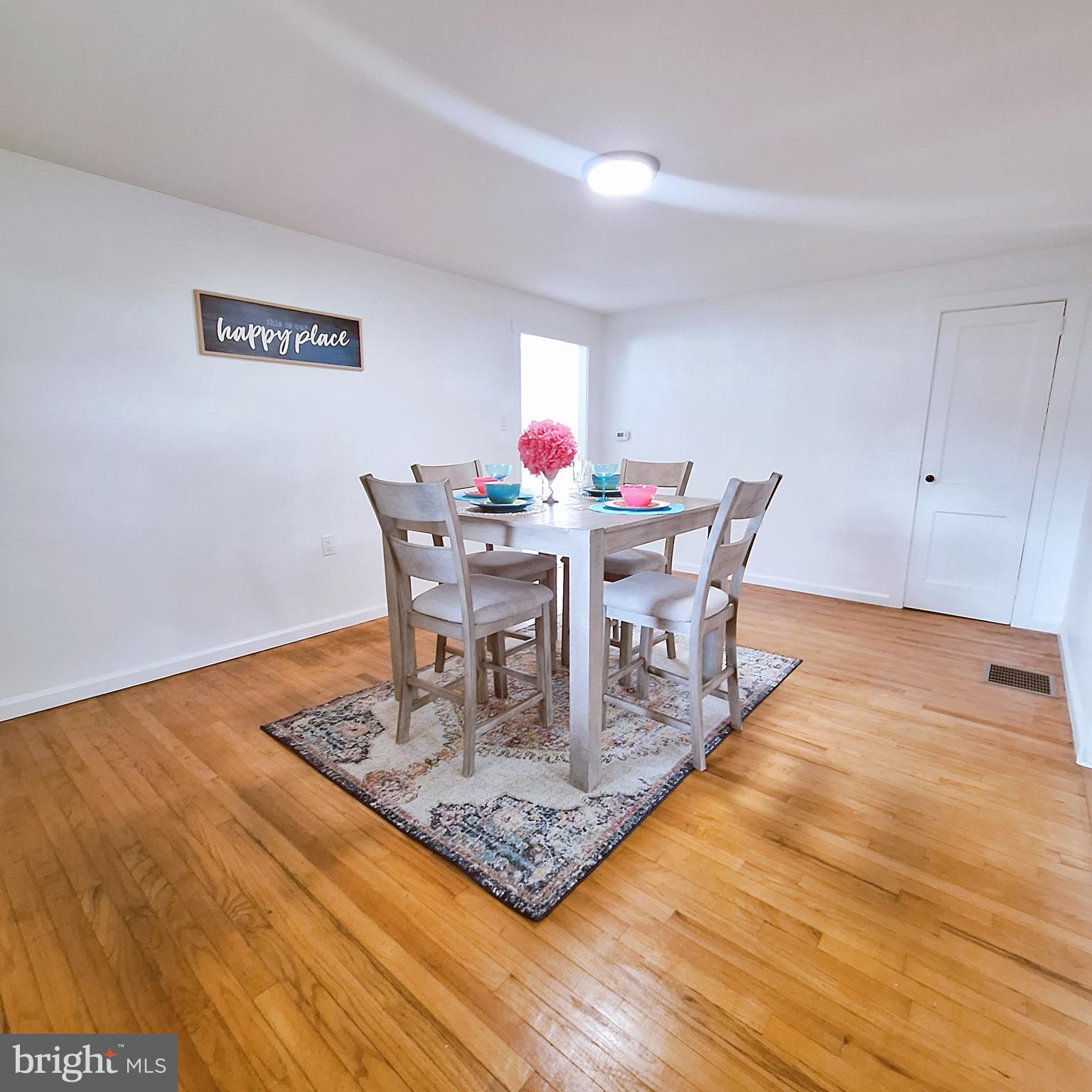 734 Pulaski Highway Bear, DE 19701 - Photo 8 of 20 a dining room with furniture and wooden floor