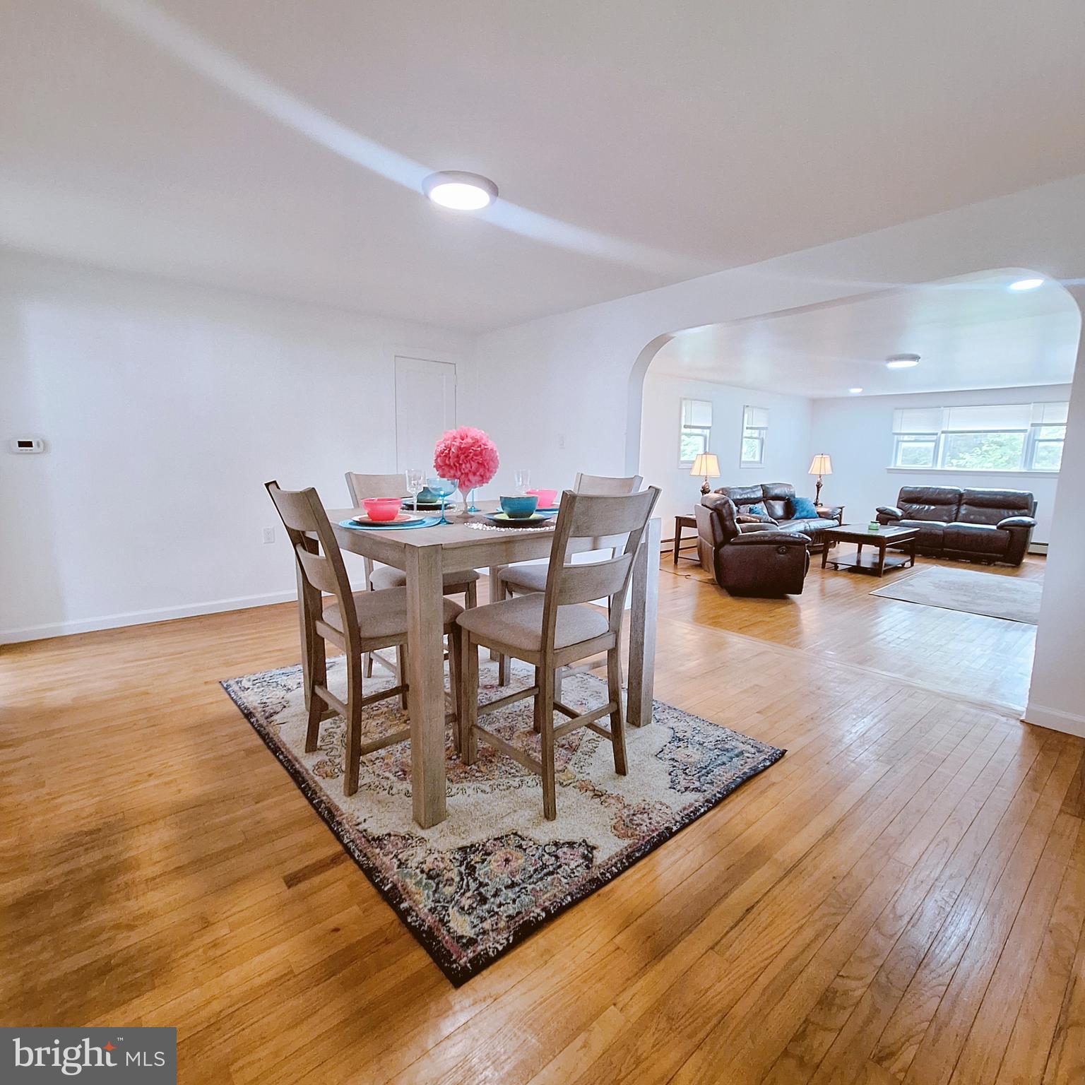 734 Pulaski Highway Bear, DE 19701 - Photo 10 of 20 a dining room with furniture and wooden floor