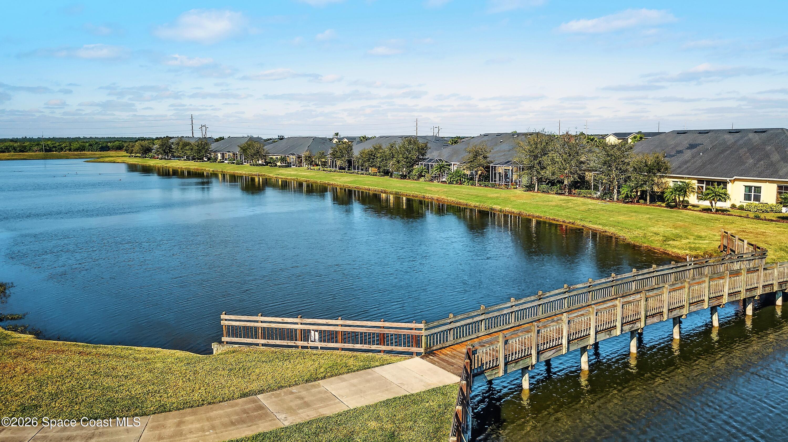 6904 Renshaw Drive Melbourne, FL 32940 - Photo 46 of 46 a view of a lake with houses