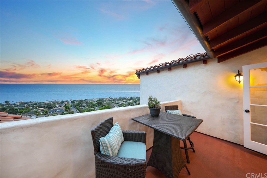 1107 Coast View Drive Laguna Beach, CA 92651 - Photo 35 of 48 a view of a terrace with furniture and a table