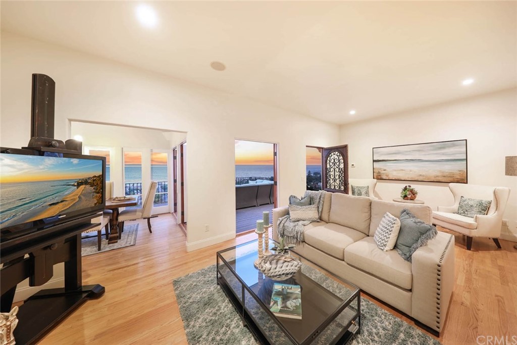 1107 Coast View Drive Laguna Beach, CA 92651 - Photo 46 of 48 a living room with furniture and wooden floor