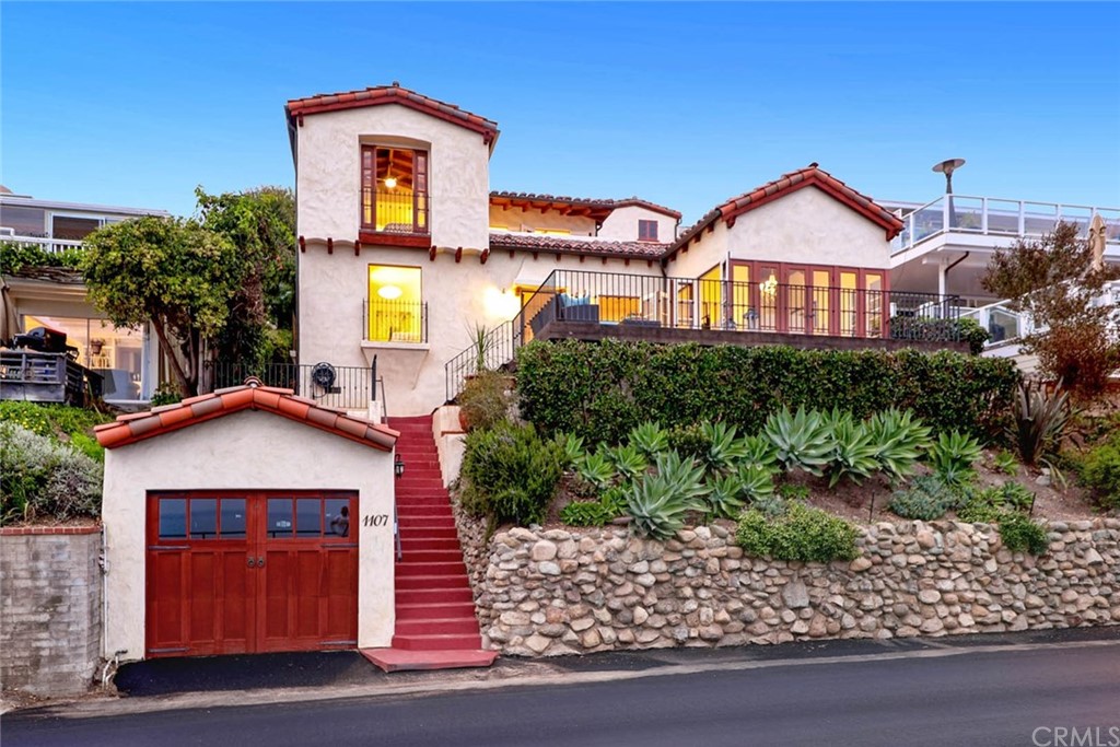 1107 Coast View Drive Laguna Beach, CA 92651 - Photo 47 of 48 a front view of a house with a yard