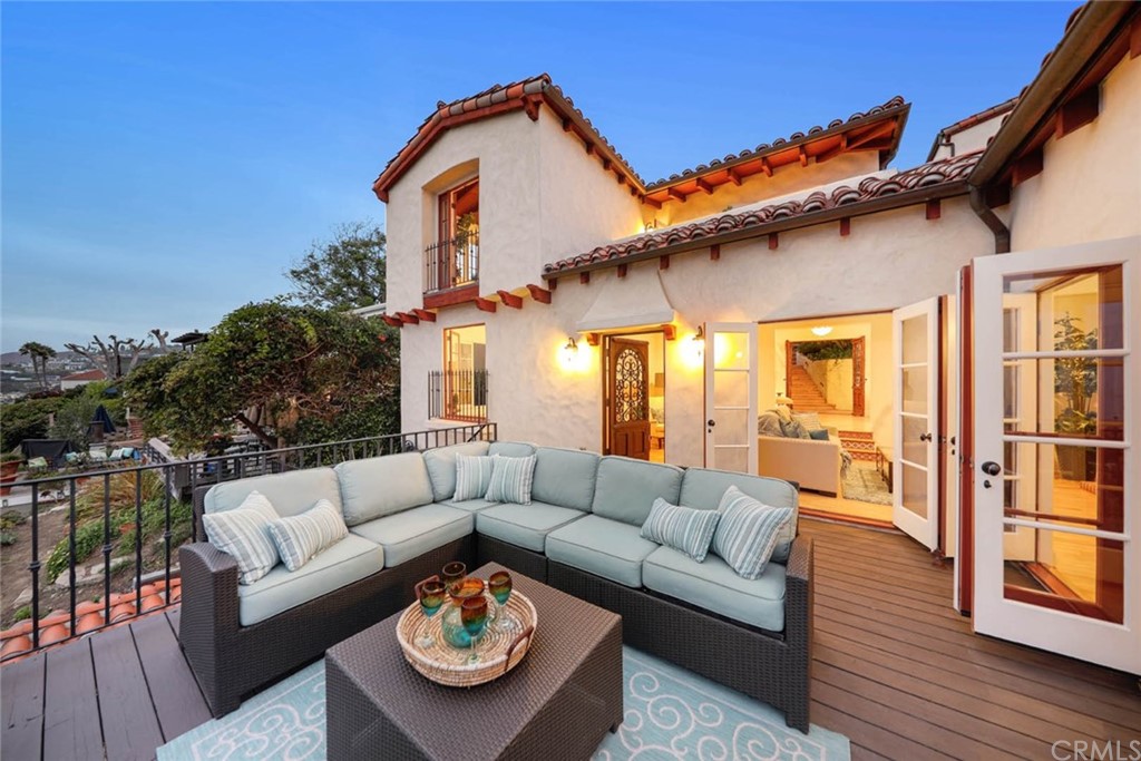 1107 Coast View Drive Laguna Beach, CA 92651 - Photo 5 of 48 a view of a house with couches chairs and wooden floor