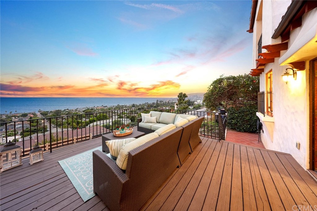 1107 Coast View Drive Laguna Beach, CA 92651 - Photo 7 of 48 a view of a balcony with wooden floor and city view