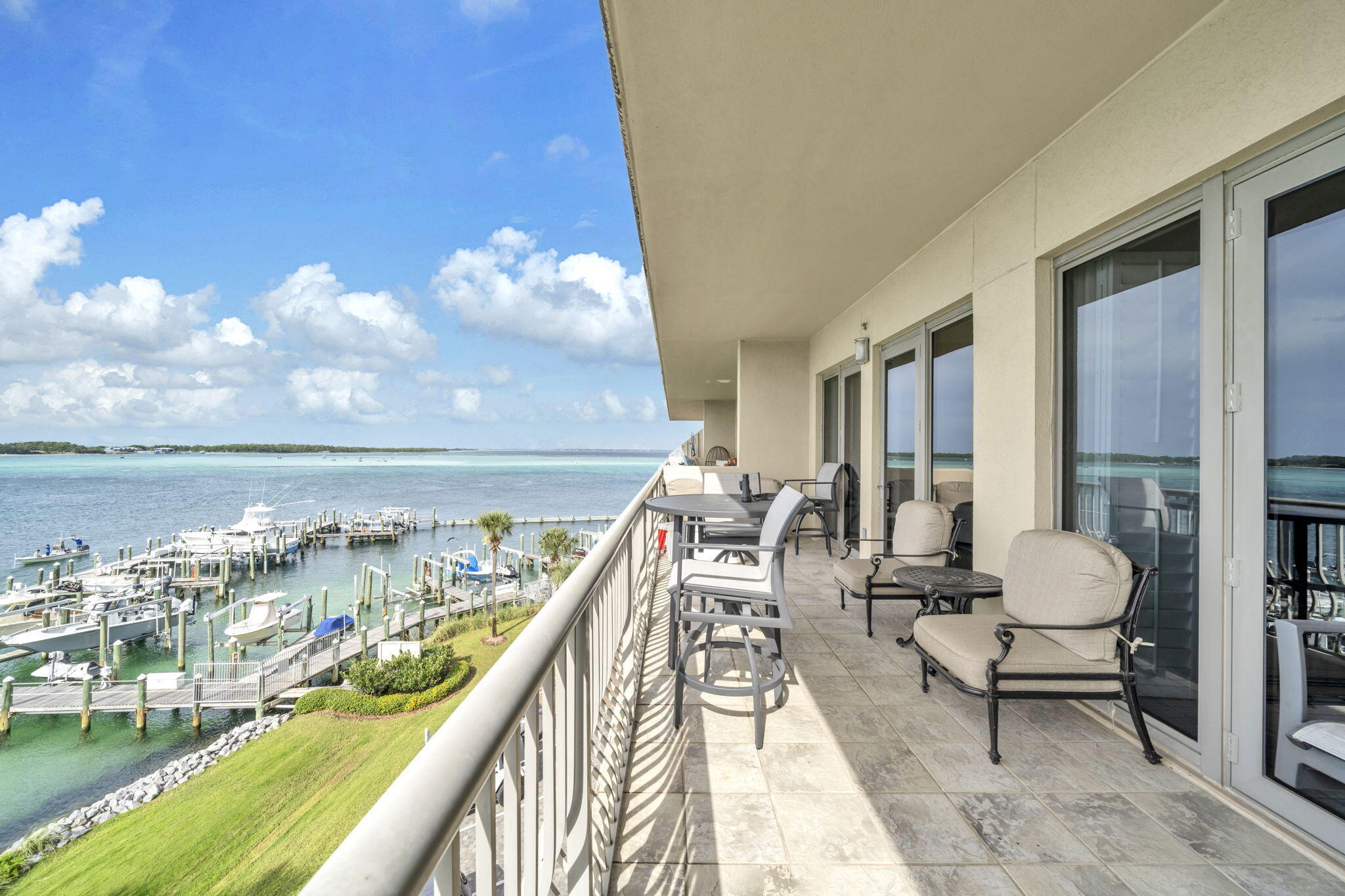 a view of a balcony with chairs and a table