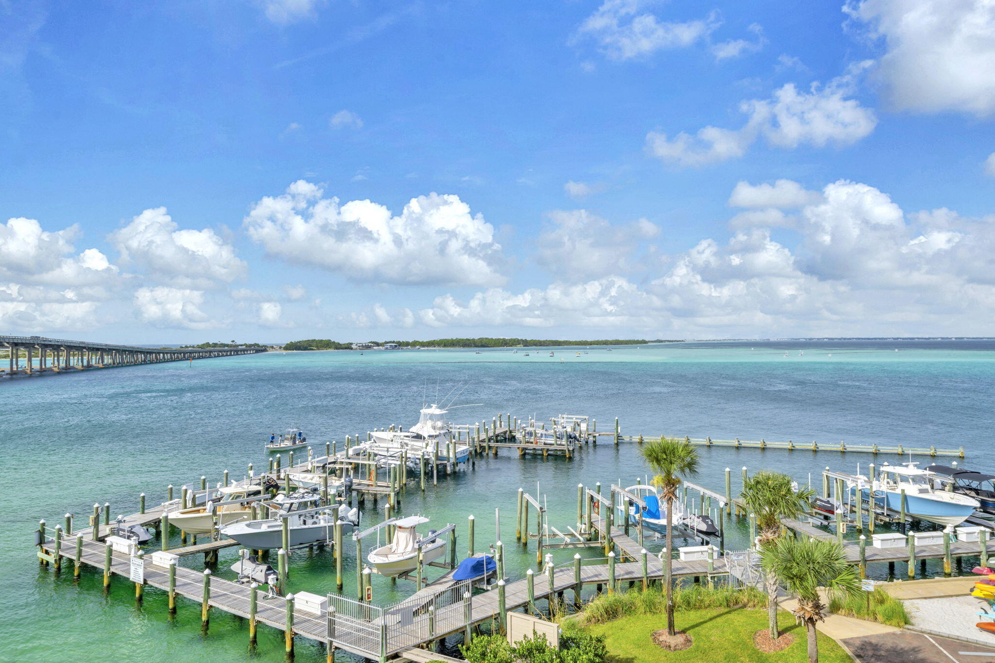5 Calhoun Avenue, Unit 403 Destin, FL 32541 - Photo 2 of 35 a view of a lake with lawn chairs
