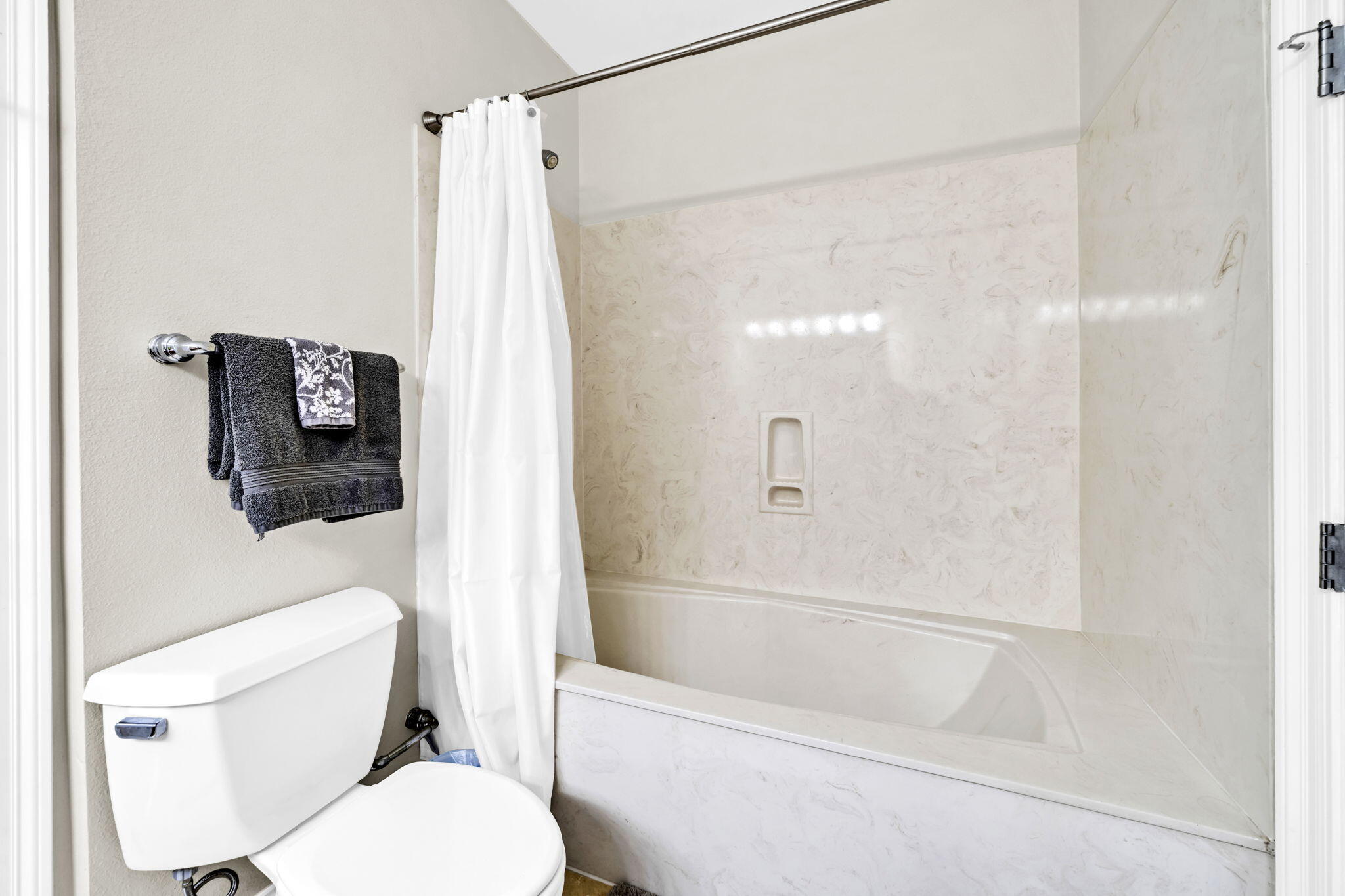 5 Calhoun Avenue, Unit 403 Destin, FL 32541 - Photo 22 of 35 a white toilet sitting next to a bath tub