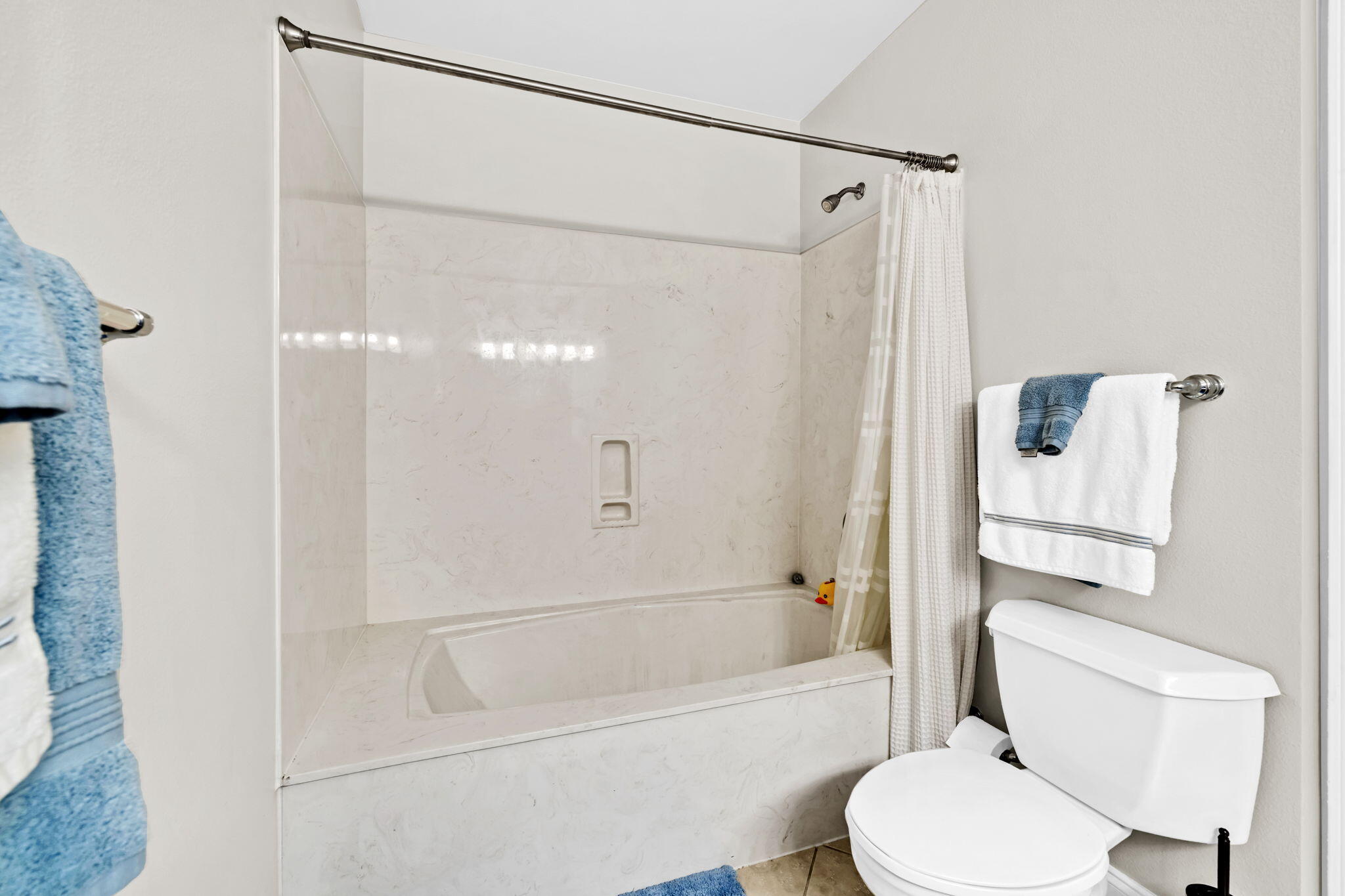 5 Calhoun Avenue, Unit 403 Destin, FL 32541 - Photo 24 of 35 a bathroom with a toilet and a shower