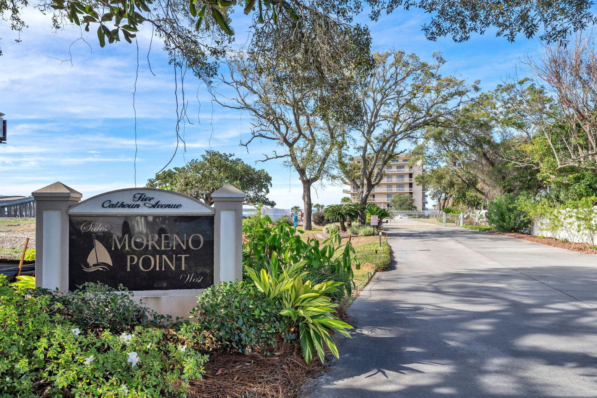 5 Calhoun Avenue, Unit 403 Destin, FL 32541 - Photo 30 of 35 a sign board with buildings in the background