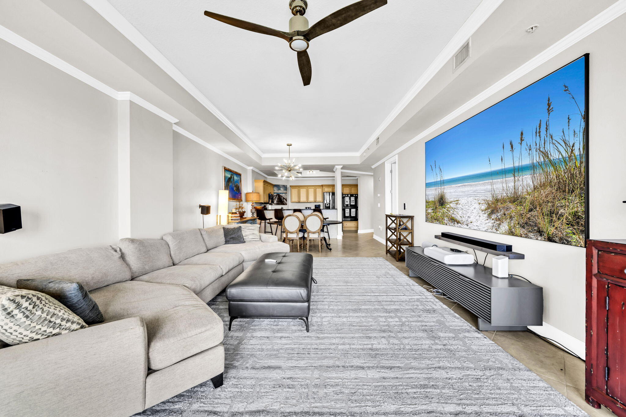 5 Calhoun Avenue, Unit 403 Destin, FL 32541 - Photo 7 of 35 a living room with furniture and a flat screen tv