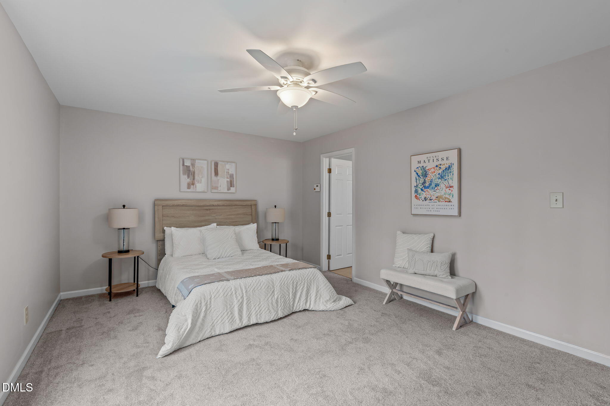 3304 Wade Avenue Raleigh, NC 27607 - Photo 18 of 38 a bedroom with a bed and a chandelier