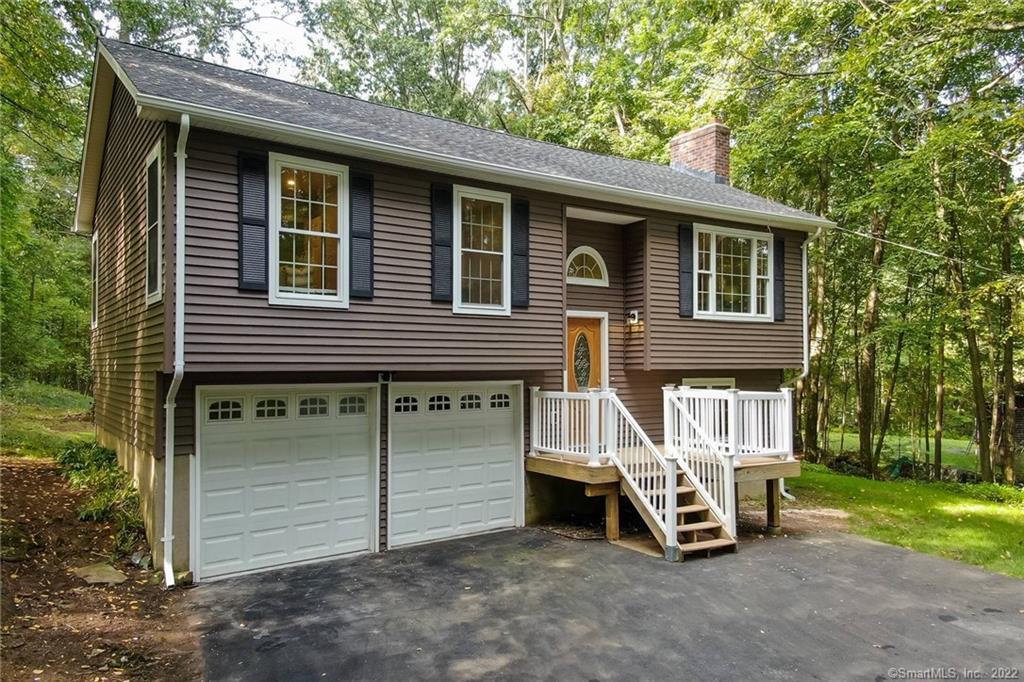 44 Buff Cap Road Ellington, CT 06029 - Photo 1 of 1 a view of a house with a yard and wooden fence