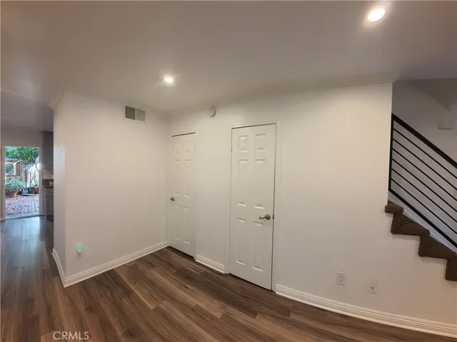 a view of room with wooden floor