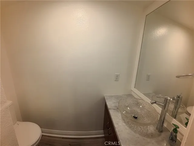 a bathroom with a sink and toilet