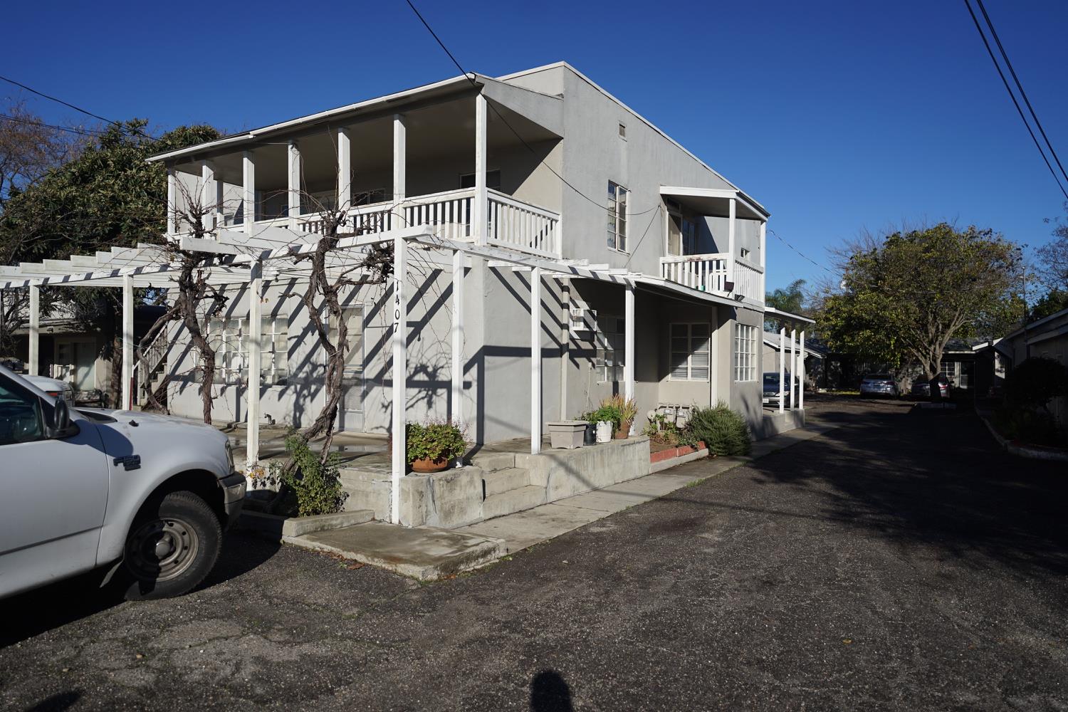 1403 Leonard Avenue Modesto, CA 95350 - Photo 2 of 6 a front view of a house with a yard