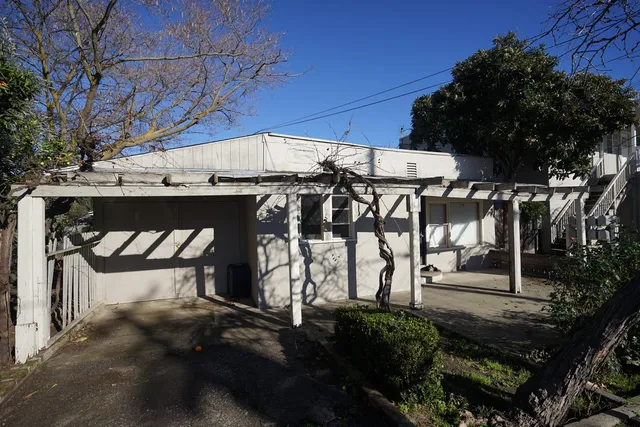 a view of a chairs and table in the patio