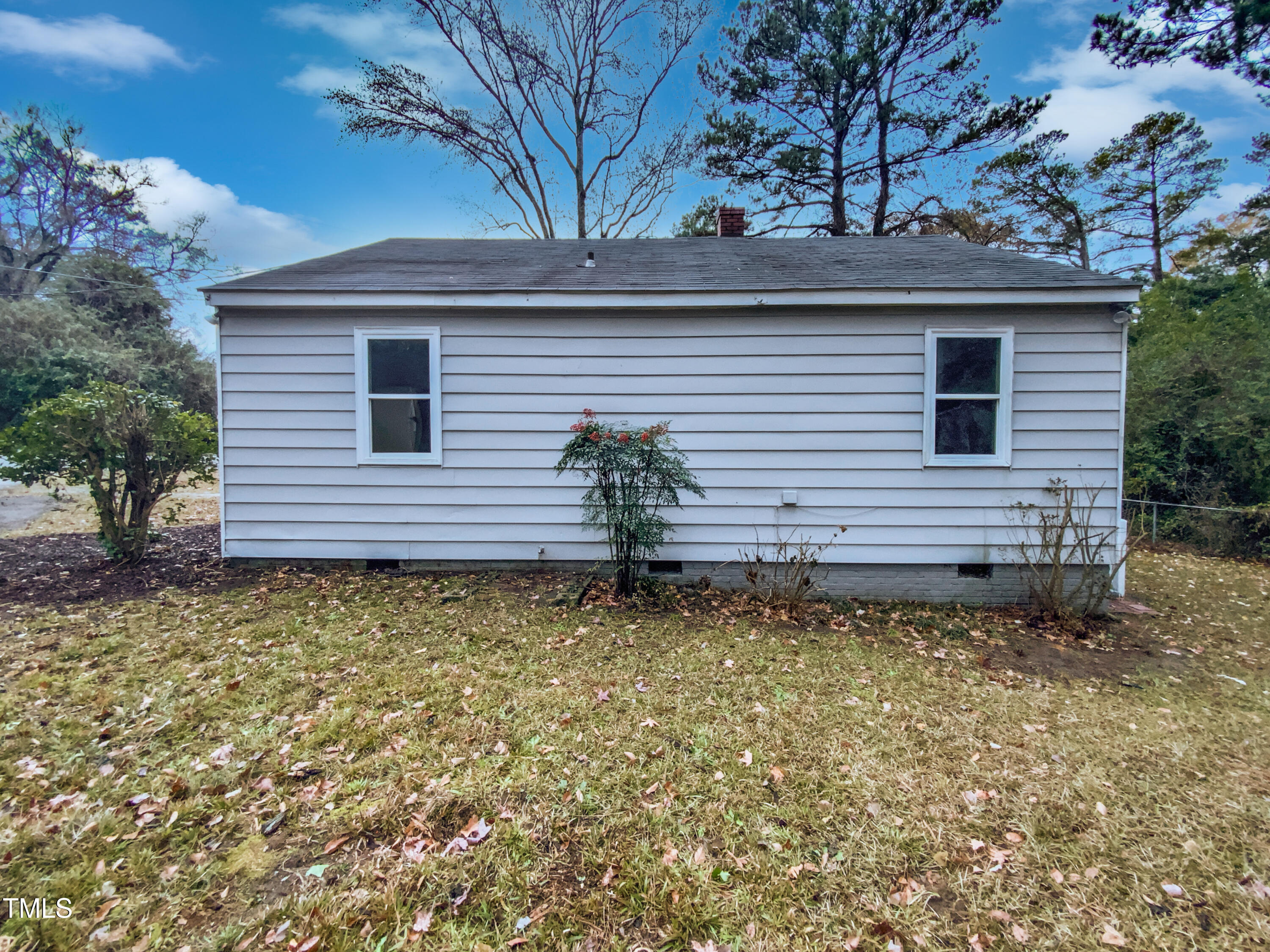 802 Powell Drive Garner, NC 27529 - Photo 16 of 17 a front view of a house with garden