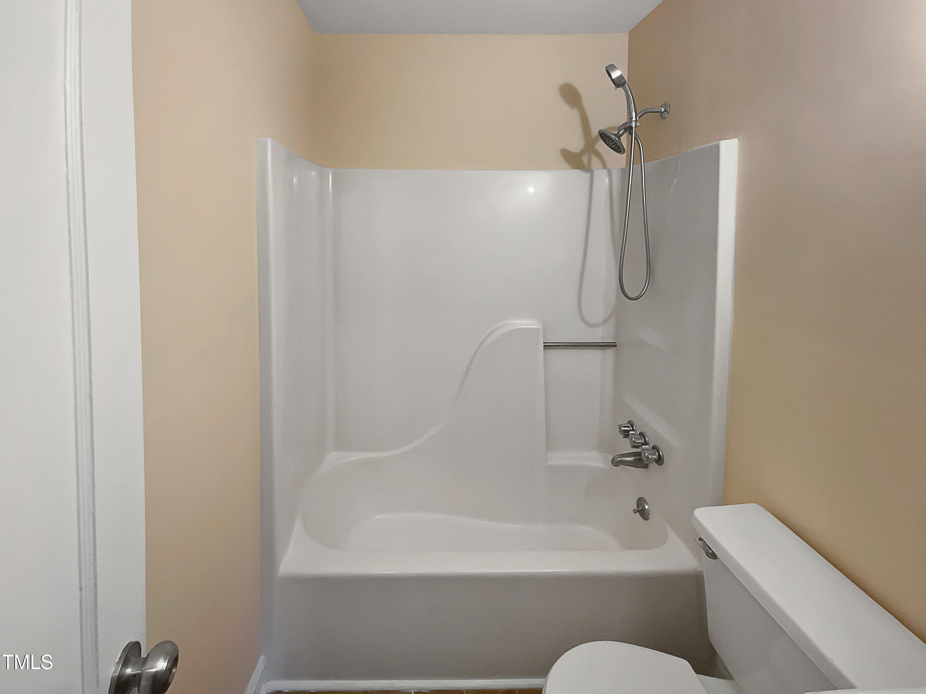 802 Powell Drive Garner, NC 27529 - Photo 7 of 17 a bathroom with a bathtub and a shower