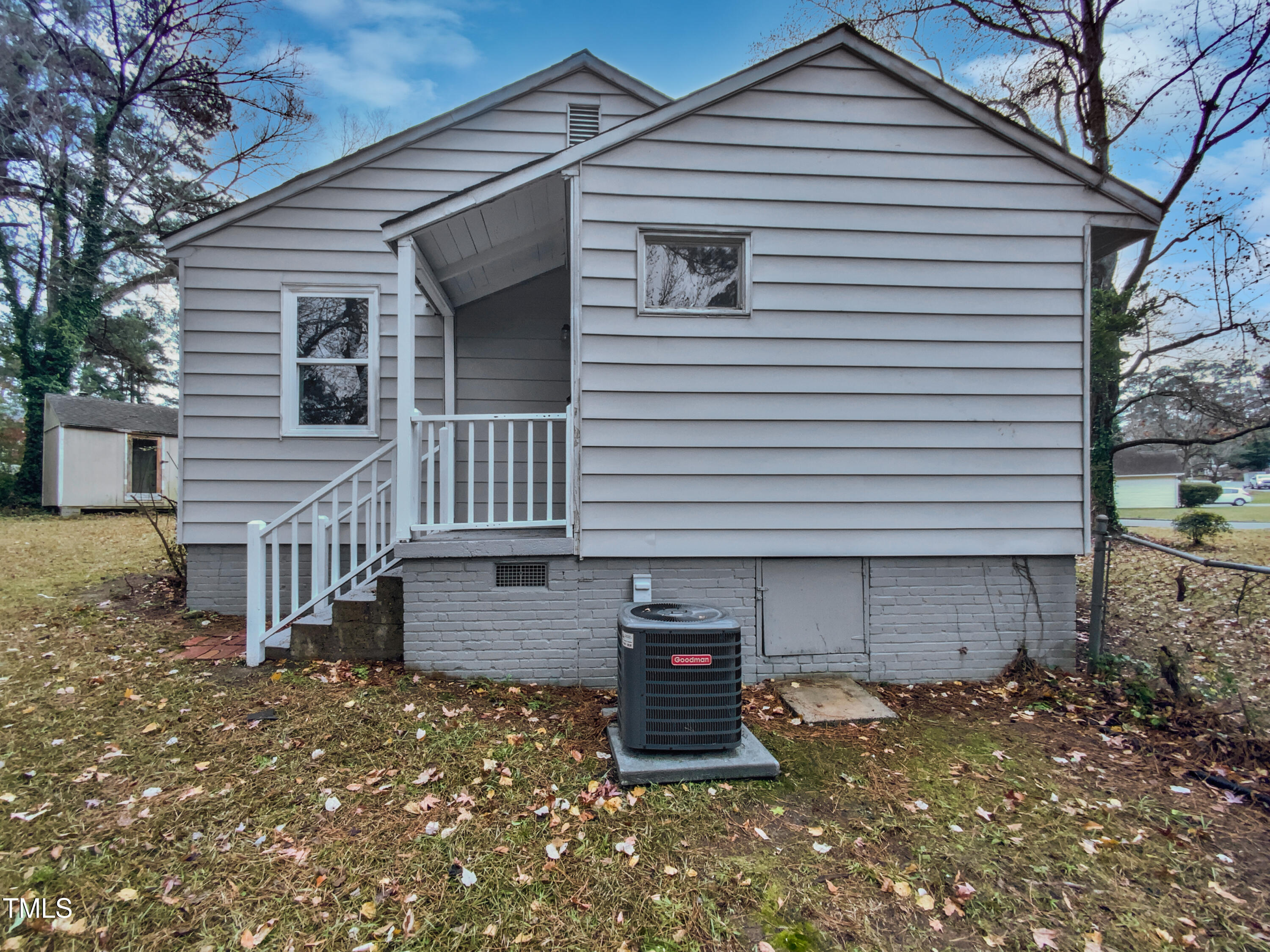 802 Powell Drive Garner, NC 27529 - Photo 8 of 17 a front view of a house with a garage