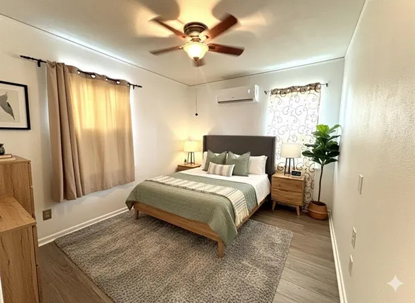 a bedroom with a bed potted plant and a window