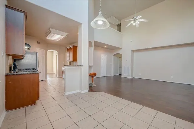 a view of a kitchen with a sink and cabinets