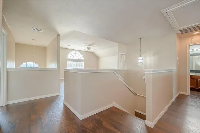 a view of a kitchen with an empty space and a window