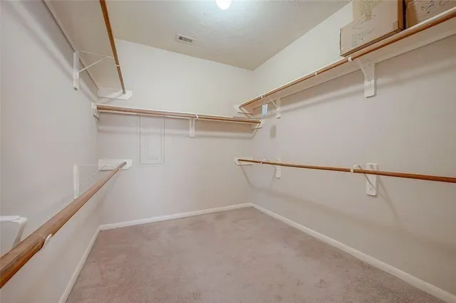 a view of a backyard with wooden fence