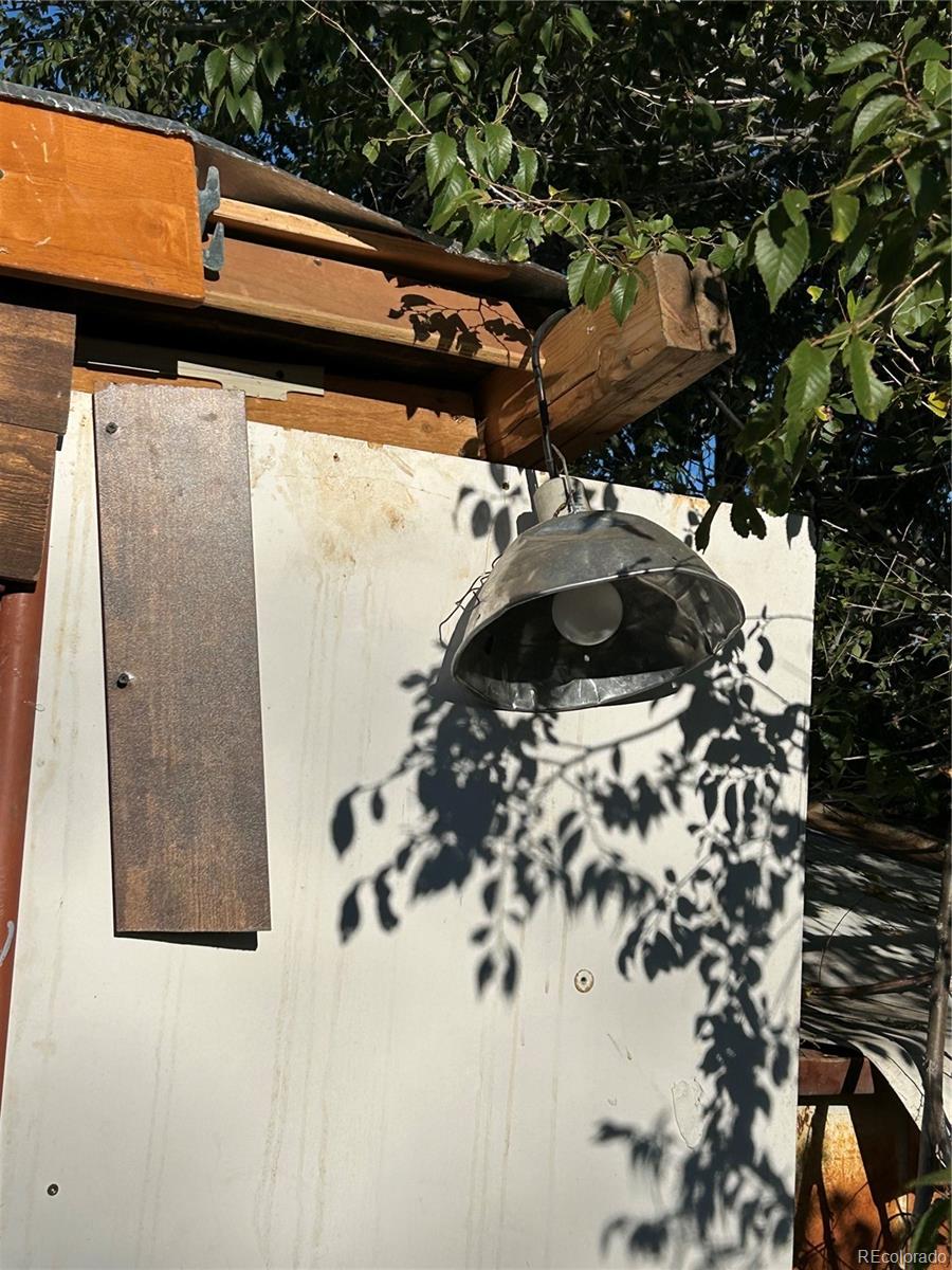 9111 Monroe Street Thornton, CO 80229 - Photo 16 of 39 a view of roof with a small yard