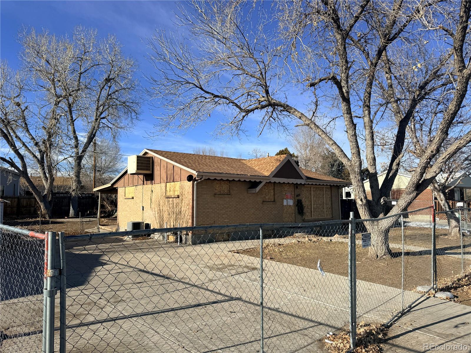 9111 Monroe Street Thornton, CO 80229 - Photo 6 of 39 a front view of a house with a yard