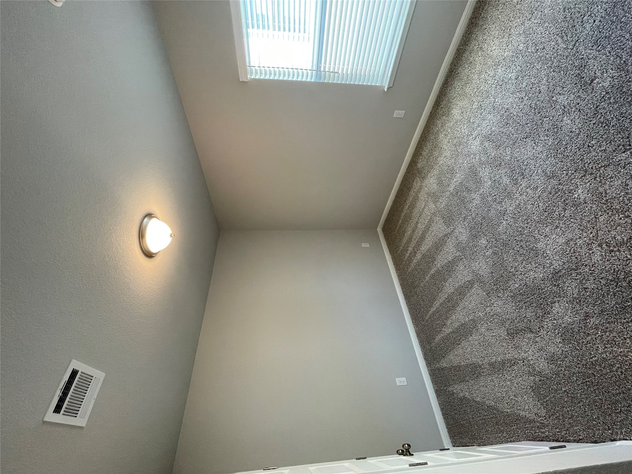 125 Unforgiven Lane Jarrell, TX 76537 - Photo 7 of 17 Spare room featuring carpet floors and a textured ceiling
