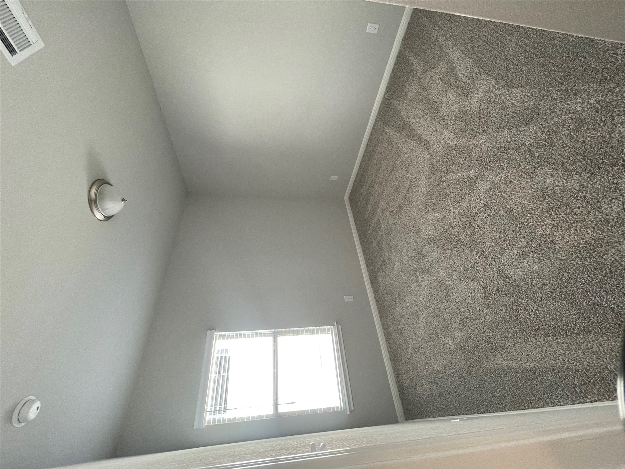 125 Unforgiven Lane Jarrell, TX 76537 - Photo 10 of 17 Unfurnished room with dark colored carpet