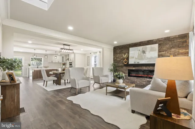 a view of entryway livingroom and hall with wooden floor