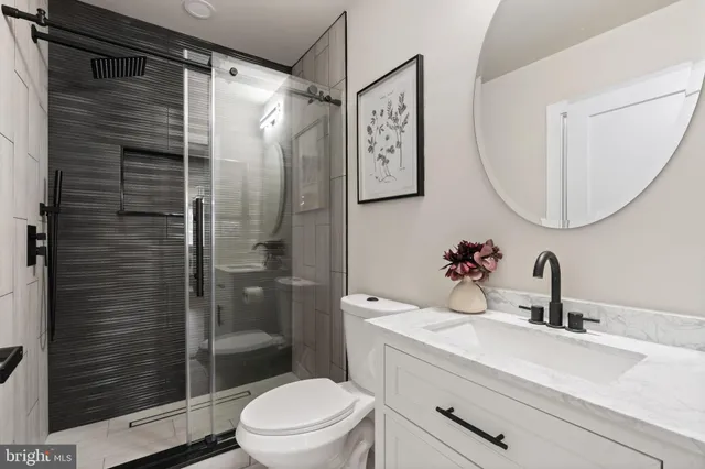 a bedroom with a bed rug and window