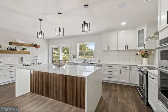 a view of storage and utility room with washer and dryer