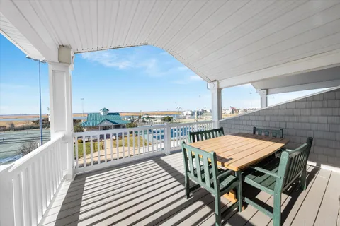 a view of a balcony with furniture