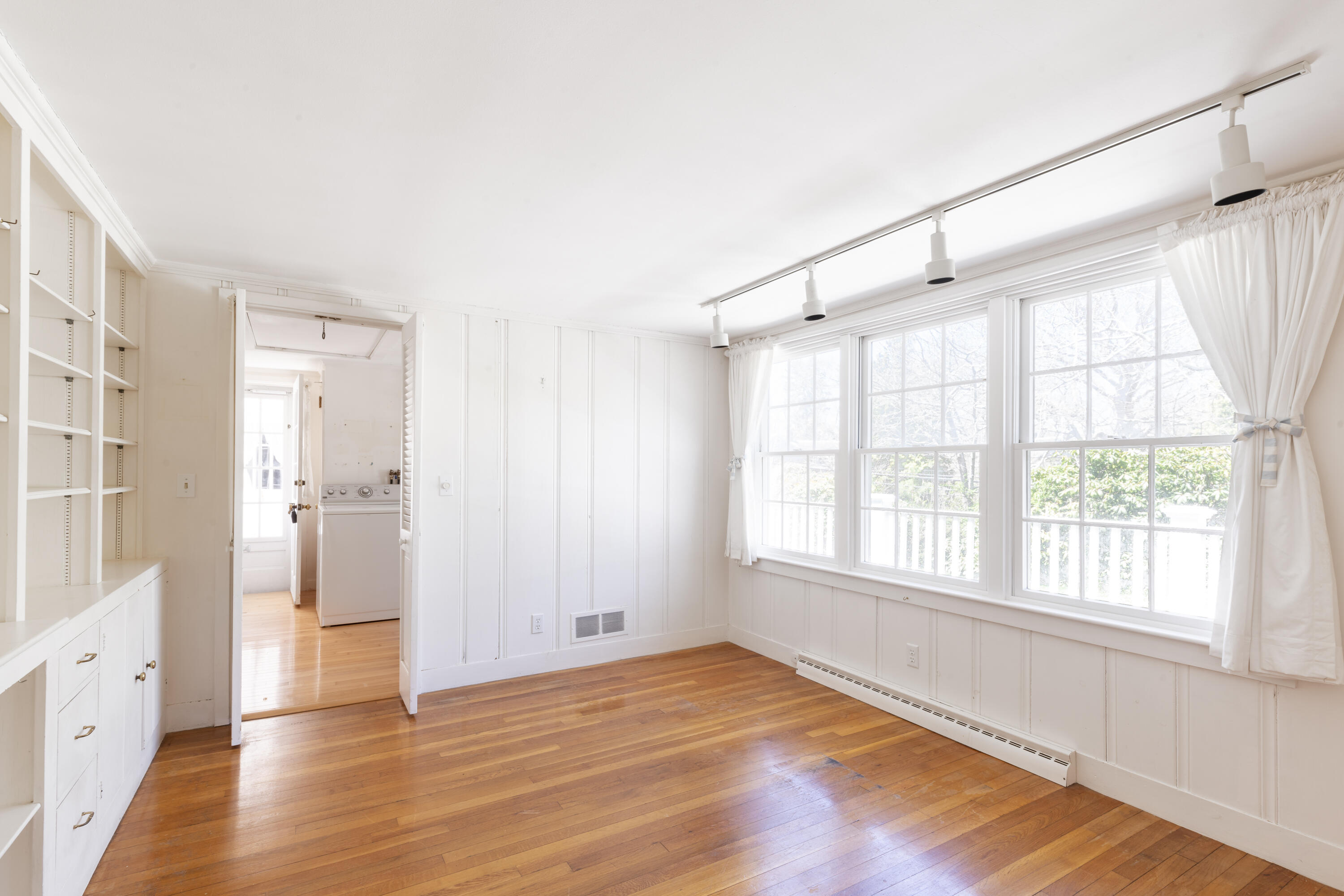 2955 Main Street Barnstable, MA 02630 - Photo 19 of 35 a view of an empty room with wooden floor and a window