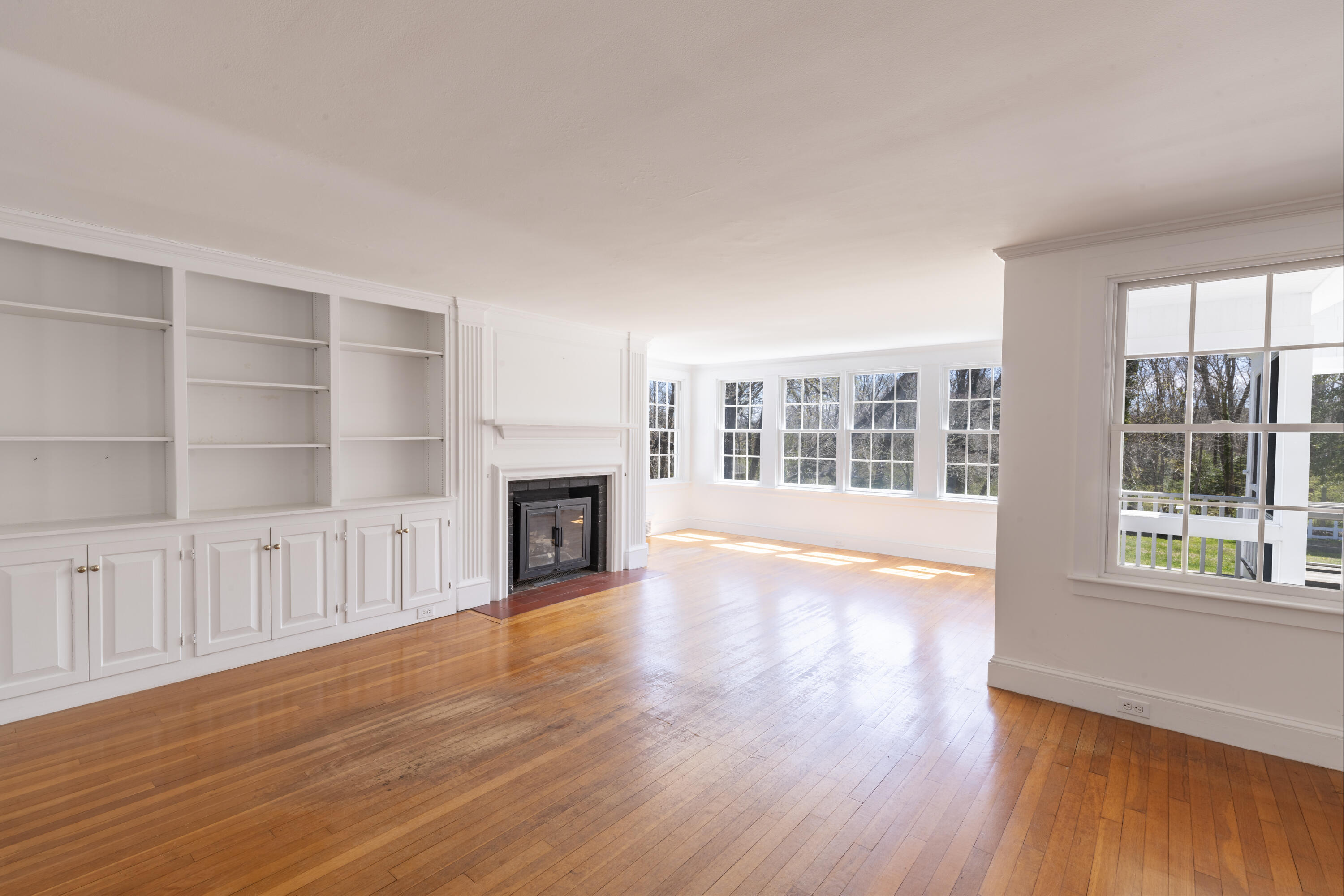 2955 Main Street Barnstable, MA 02630 - Photo 22 of 35 a view of an empty room with wooden floor and a window