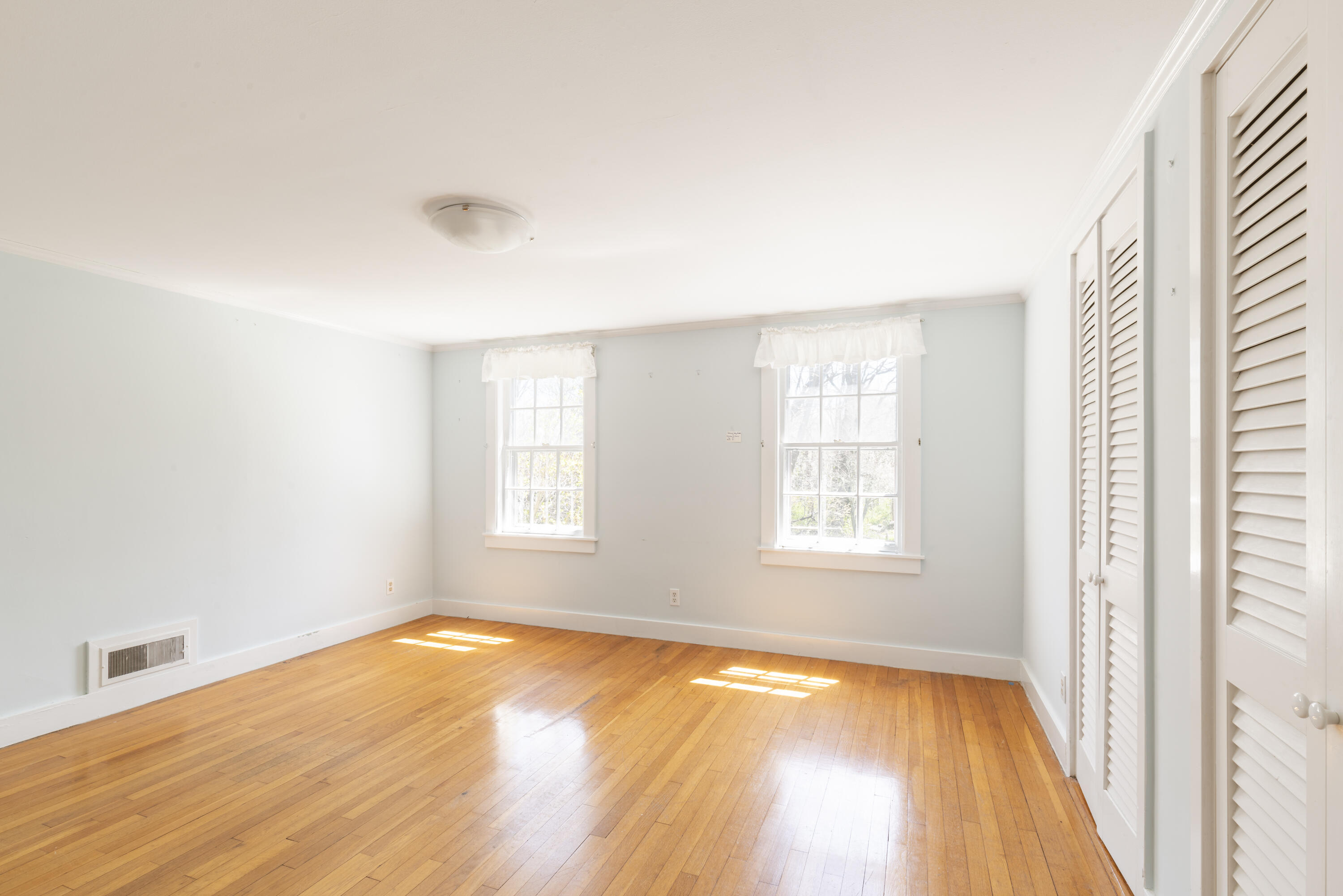 2955 Main Street Barnstable, MA 02630 - Photo 26 of 35 a view of empty room with wooden floor and fan