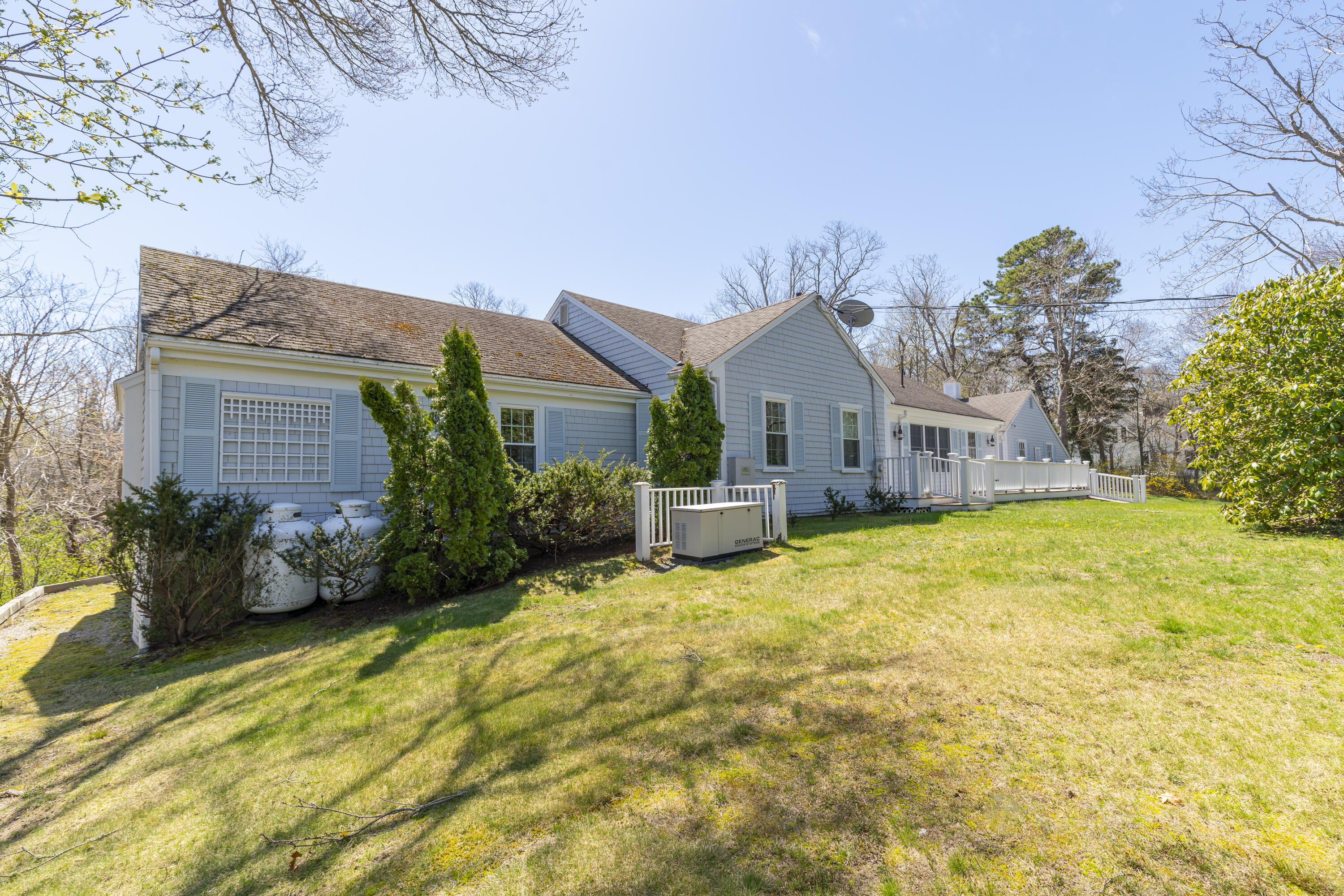 2955 Main Street Barnstable, MA 02630 - Photo 35 of 35 a front view of small house with yard and green space
