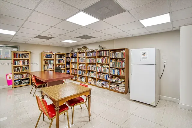a living room with furniture and flowers