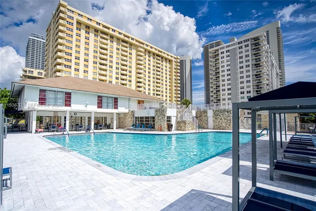 a front view of a building with garden