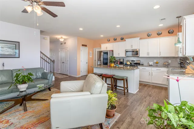 a living room with furniture fireplace and a flat screen tv