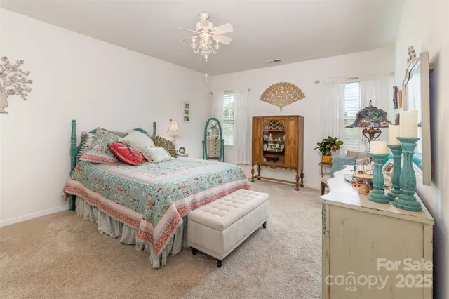 a bathroom with a toilet a sink and a mirror
