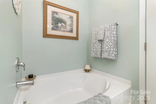 a view of a hallway with wooden shelves