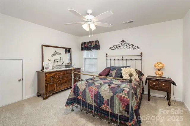 a view of backyard with outdoor seating and plants