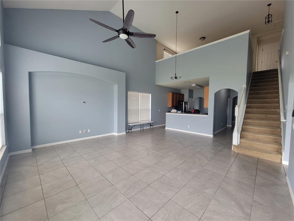 2734 Rochelle Drive Winter Haven, FL 33881 - Photo 12 of 38 a view of a livingroom with furniture and staircase