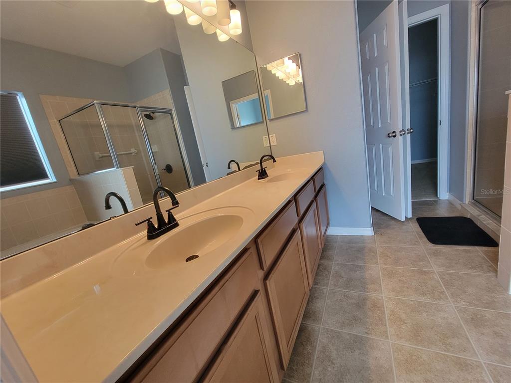 2734 Rochelle Drive Winter Haven, FL 33881 - Photo 19 of 38 a bathroom with a sink and a mirror