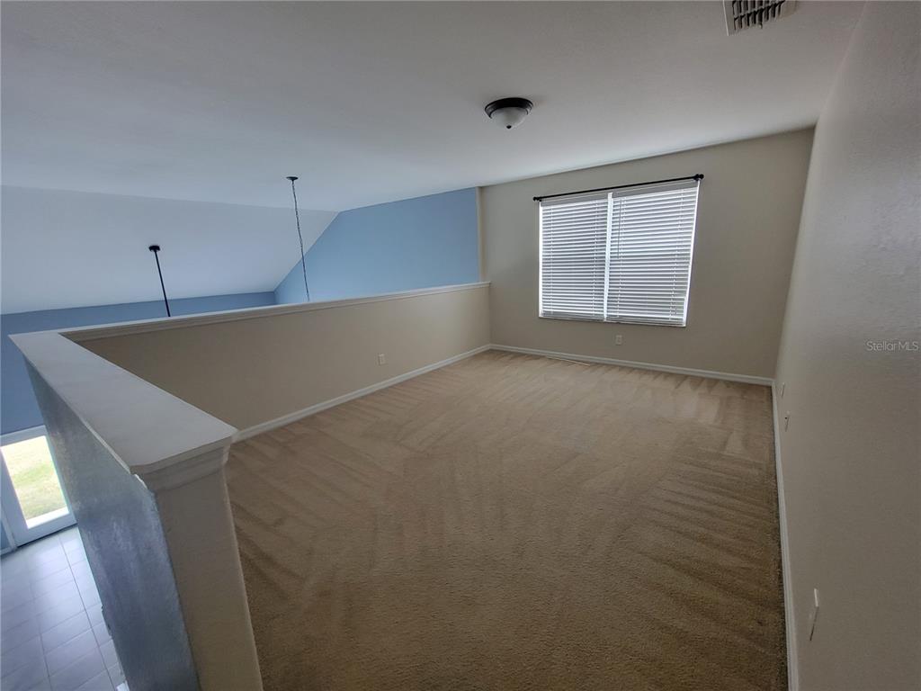 2734 Rochelle Drive Winter Haven, FL 33881 - Photo 24 of 38 an empty room with windows